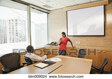 Picture - Black businesspeople talking in conference room. Fotosearch