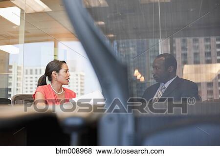 Stock Photo - Black businesspeople working in conference room. Fotosearch