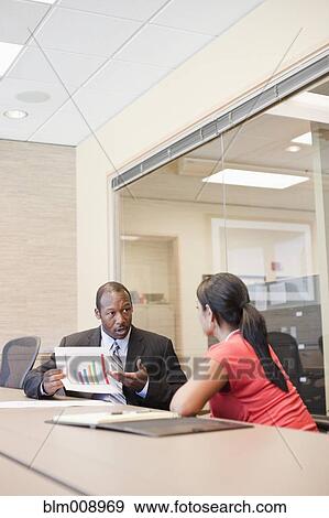 Black businesspeople working in conference room View Large Photo Image Stock Photo - Black businesspeople working in conference room. Fotosearch