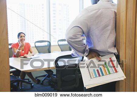 Stock Photo - Black businesspeople working in conference room. Fotosearch