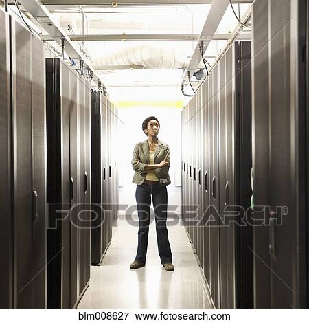 Stock Photo - Black businesswoman working in office technology room. Fotosearch