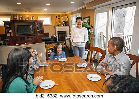 Black family celebrating birthday at table View Large Photo Image Stock Image - Black family celebrating birthday at table. Fotosearch