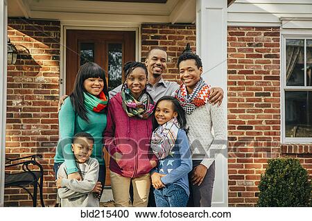 Black family smiling outside house View Large Photo Image Stock Image - Black family smiling outside house. Fotosearch