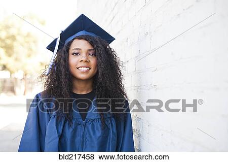 Black graduate wearing cap and gown View Large Photo Image Stock Photo - Black graduate wearing cap and gown. Fotosearch