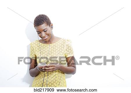 Black woman listening to mp3 player View Large Photo Image Stock Photo - Black woman listening to mp3 player. Fotosearch
