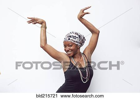 Black woman posing with arms raised View Large Photo Image Stock Image - Black woman posing with arms raised. Fotosearch