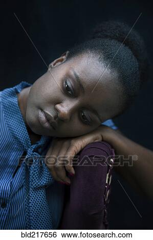 Black woman resting head on armchair View Large Photo Image Stock Photograph - Black woman resting head on armchair. Fotosearch