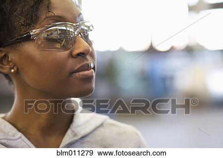 Stock Photo - Black worker in protective eyewear. Fotosearch