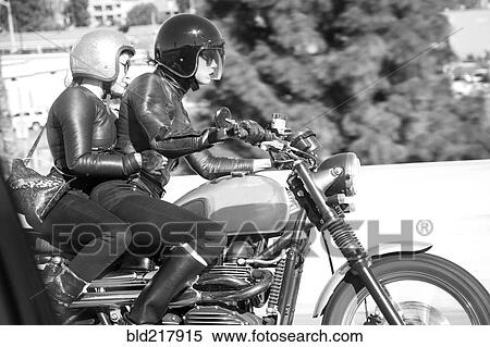 Blurred view of women riding motorcycle View Large Photo Image Stock Photography - Blurred view of women riding motorcycle. Fotosearch