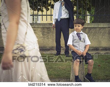 Picture - Bored boy wearing formal clothing at event. Fotosearch