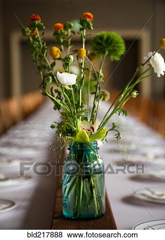 Bouquet of flowers on banquet table View Large Photo Image Stock Photo - Bouquet of flowers on banquet table. Fotosearch