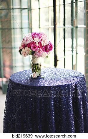 Stock Photo - Bouquet of flowers on party table. Fotosearch
