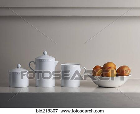 Bowl of fresh fruit and white pitchers View Large Photo Image Stock Photo - Bowl of fresh fruit and white pitchers. Fotosearch