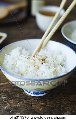 Bowl of rice and chopsticks View Large Photo Image Stock Image - Bowl of rice and chopsticks. Fotosearch