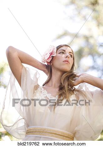 Bride walking under trees View Large Photo Image Stock Image - Bride walking under trees. Fotosearch