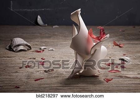 Broken pottery vase on wooden table View Large Photo Image Stock Photo - Broken pottery vase on wooden table. Fotosearch