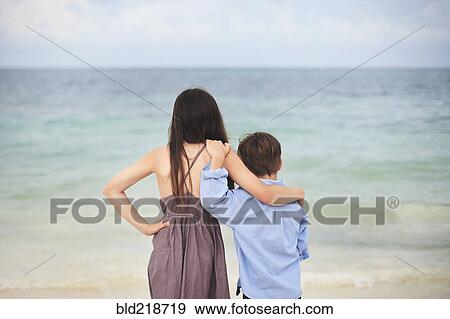 Brother and sister hugging on beach View Large Photo Image Stock Photo - Brother and sister hugging on beach. Fotosearch