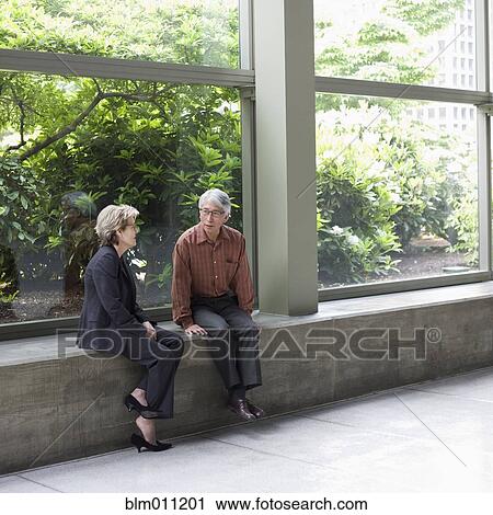 Business people talking in lobby View Large Photo Image Stock Image - Business people talking in lobby. Fotosearch