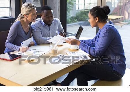 Business people talking in office meeting View Large Photo Image Stock Image - Business people talking in office meeting. Fotosearch