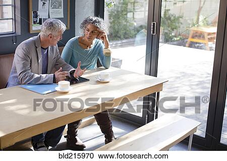 Business people talking in office meeting View Large Photo Image Stock Image - Business people talking in office meeting. Fotosearch
