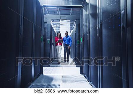 Business people talking in server room View Large Photo Image Stock Photography - Business people talking in server room. Fotosearch