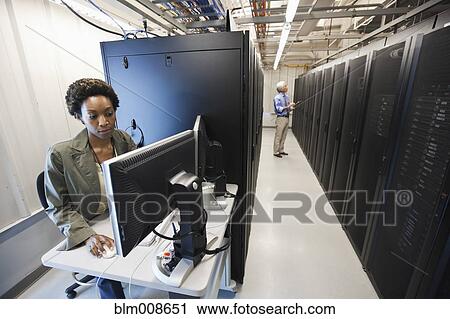 Business people working in office technology room View Large Photo Image Stock Image - Business people working in office technology room. Fotosearch