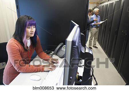 Business people working in office technology room View Large Photo Image Stock Image - Business people working in office technology room. Fotosearch