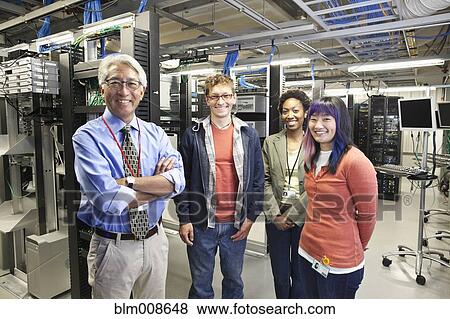 Business people working in office technology room View Large Photo Image Stock Photo - Business people working in office technology room. Fotosearch