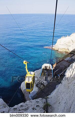 Cable car nearing stop next to ocean View Large Photo Image Stock Image - Cable car nearing stop next to ocean. Fotosearch