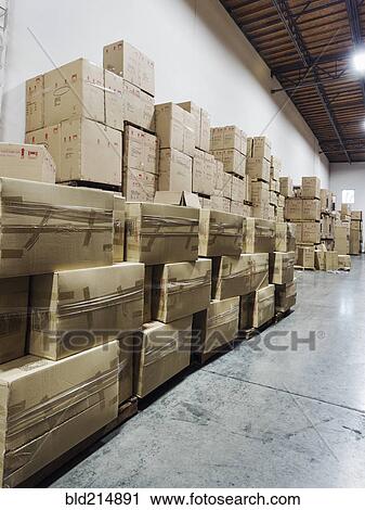 Stock Image - Cardboard boxes in warehouse. Fotosearch