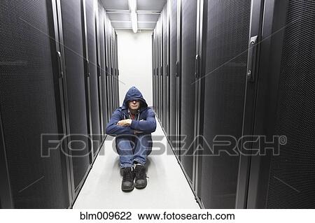 Caucasian businessman sitting in office technology room View Large Photo Image Stock Image - Caucasian businessman sitting in office technology room. Fotosearch
