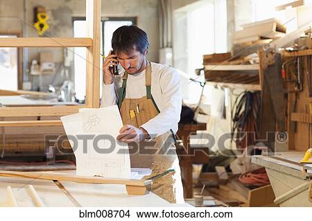Caucasian carpenter working in workshop View Large Photo Image Picture - Caucasian carpenter working in workshop. Fotosearch