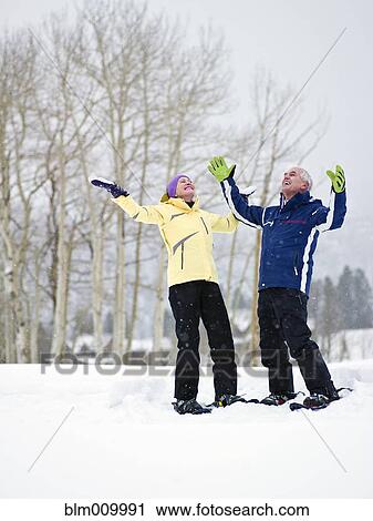 Caucasian couple enjoying snow View Large Photo Image Stock Image - Caucasian couple enjoying snow. Fotosearch