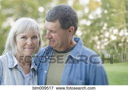 Stock Photo - Caucasian couple standing outdoors. Fotosearch