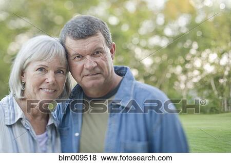Caucasian couple standing outdoors View Large Photo Image Stock Photo - Caucasian couple standing outdoors. Fotosearch