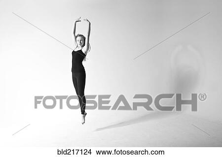 Picture - Caucasian dancer jumping for joy. Fotosearch