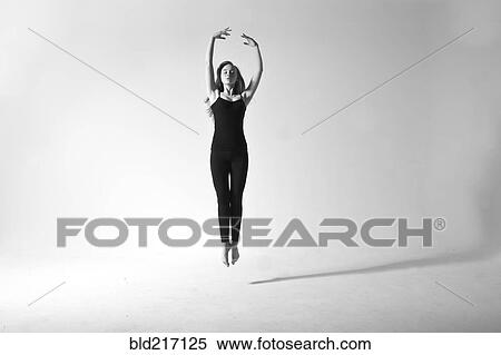Stock Photography - Caucasian dancer jumping for joy. Fotosearch