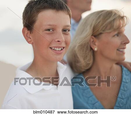 Caucasian family enjoying beach View Large Photo Image Stock Photo - Caucasian family enjoying beach. Fotosearch