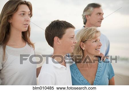 Caucasian family enjoying beach View Large Photo Image Stock Photography - Caucasian family enjoying beach. Fotosearch