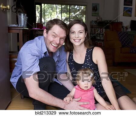 Caucasian family smiling together View Large Photo Image Stock Photo - Caucasian family smiling together. Fotosearch