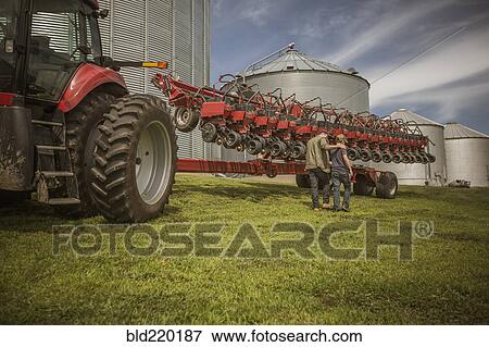 Caucasian farmer and son walking on farm View Large Photo Image Stock Photo - Caucasian farmer and son walking on farm. Fotosearch