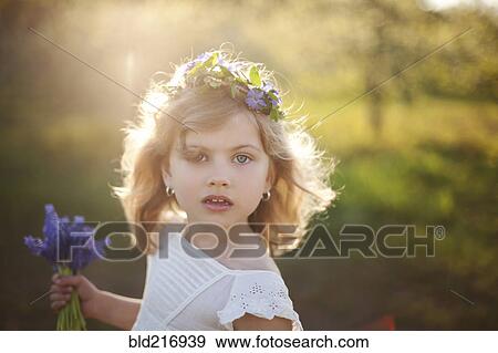 Caucasian girl carrying flowers outdoors View Large Photo Image Stock Photo - Caucasian girl carrying flowers outdoors. Fotosearch