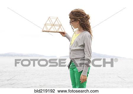 Caucasian girl examining project View Large Photo Image Stock Image - Caucasian girl examining project. Fotosearch