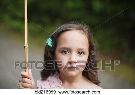 Stock Photo - Caucasian girl holding butterfly net. Fotosearch
