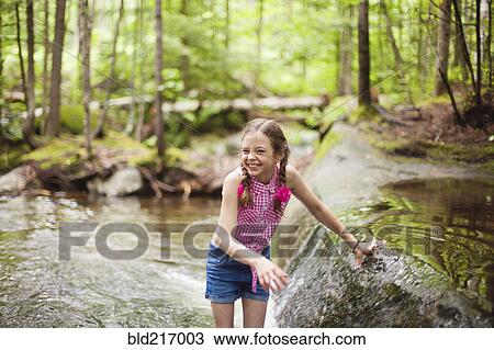 Caucasian girl laughing in river View Large Photo Image Stock Image - Caucasian girl laughing in river. Fotosearch