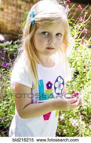 Caucasian girl playing in backyard View Large Photo Image Stock Photography - Caucasian girl playing in backyard. Fotosearch