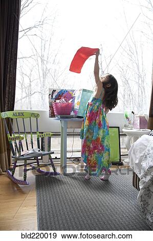 Caucasian girl playing in bedroom View Large Photo Image Stock Photo - Caucasian girl playing in bedroom. Fotosearch