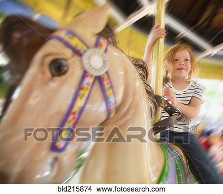 Caucasian girl riding horse on carousel View Large Photo Image Picture - Caucasian girl riding horse on carousel. Fotosearch