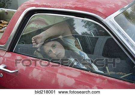 Caucasian girl sitting in vintage truck View Large Photo Image Stock Image - Caucasian girl sitting in vintage truck. Fotosearch
