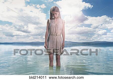 Caucasian girl standing in lake View Large Photo Image Stock Image - Caucasian girl standing in lake. Fotosearch